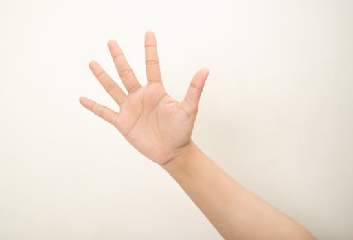 Hand pointing at something and make a sign on white background photo