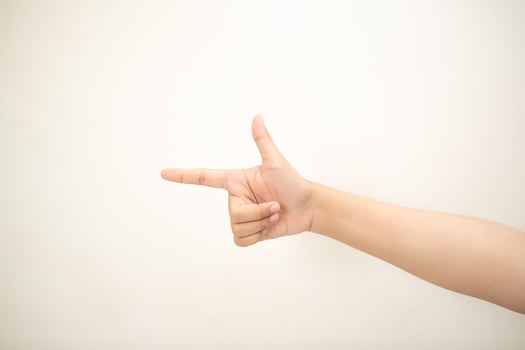 Hand pointing at something on white background photo