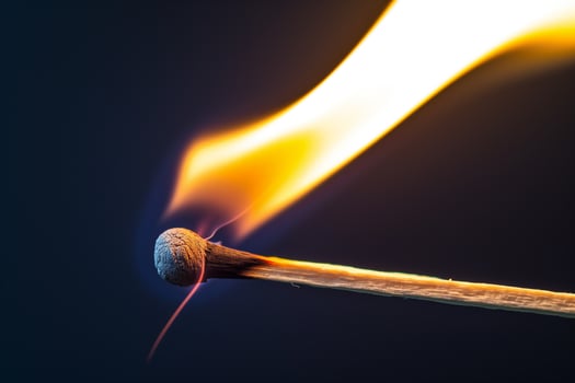 AI generated burning match close-up on a dark background photo