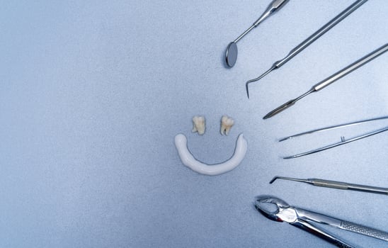 Dentist equipment for work. Composition of smiling face and different tools. photo