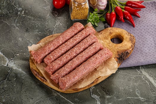 Raw beef kebab sausage for grill photo