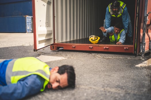 Engineer wear PPE urgently assisted the male technique inside container as Chemical spill in the container shipping industry photo