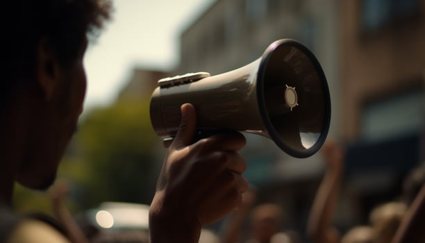 AI generated One person shouting, holding megaphone, addressing enthusiastic audience outdoors generated by AI photo