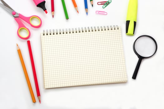 School supplies or office supplies and graph book on white background. Learning, study, office equipment and presentation concept. photo