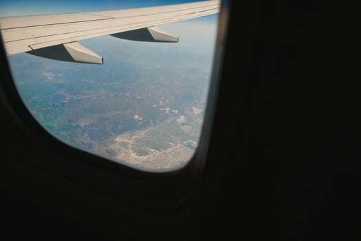 Looking through window aircraft during flight in wing with a nice blue sky photo