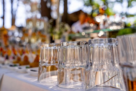 Shine cocktails glasses close up. Inverted bar clean glasses with restaurant background. photo
