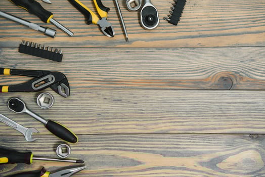Different tools on a wooden background. photo