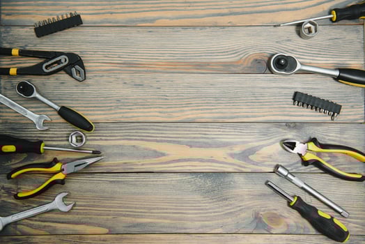 Different tools on a wooden background. photo
