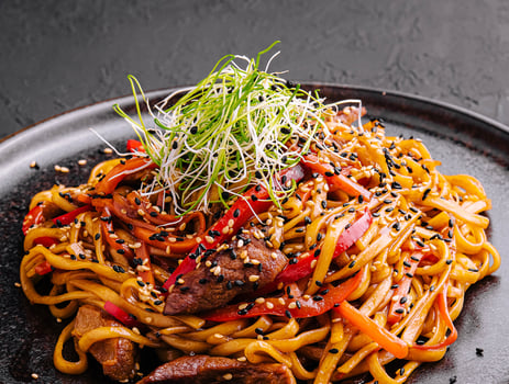 Traditional japanese noodles with vegetables in a plate photo