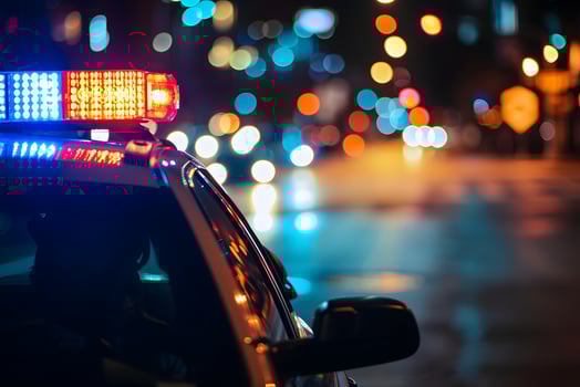 AI Generated police car lights at night in city street with selective focus and bokeh photo