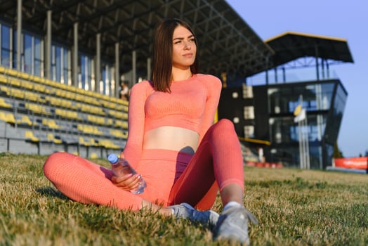 Fitness woman on city stadium photo