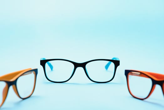 Child's plastic frame for glasses. Mock up for the design of optics store and shop, eye clinic. Glasses for reading and distance, correction of sight. Beautiful eyeglasses rim. photo