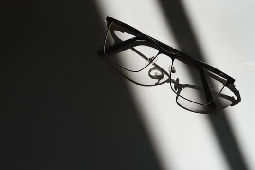 Black eyeglasses with white background photo