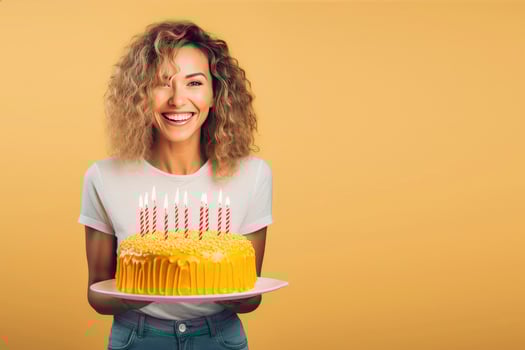 AI generated Beautiful happy young woman stand over yellow background, holding birthday cake with candle on a plate photo