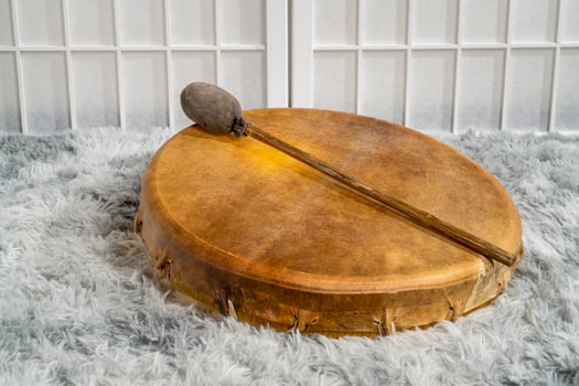 handmade, native American style, shaman frame drum covered by goat skin with a beater photo