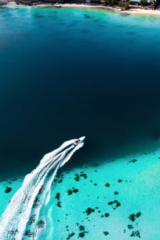 Top view of the Blue Bay lagoon of Mauritius. A boat floats on a turquoise lagoon photo