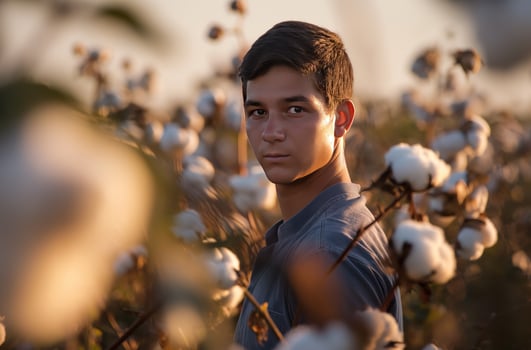 AI generated Young farmer in cotton field photo
