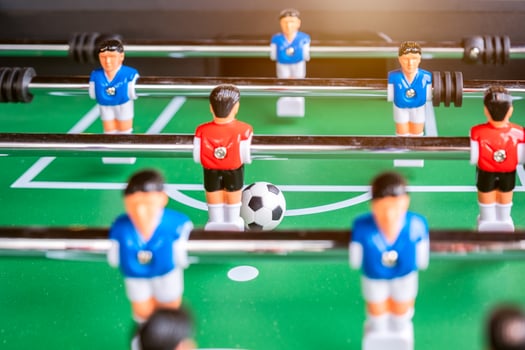 Close-up of Table football soccer game on green field photo