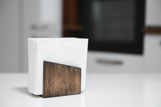 Wooden napkin holder in kitchen photo