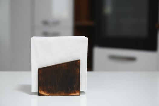 Wooden napkin holder in kitchen photo