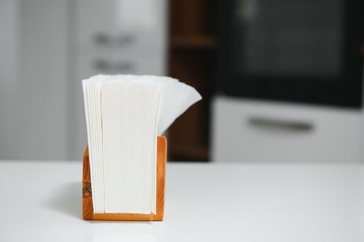 Wooden napkin holder in kitchen photo
