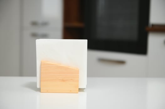 Wooden napkin holder in kitchen photo