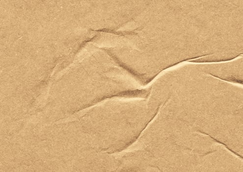 Crumpled brown kraft paper texture banner background photo