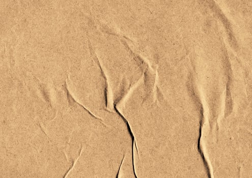 Crumpled brown kraft paper texture banner background photo