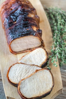 Pork loin wrapped in bacon photo