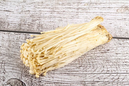 Tasty raw enoki mushroom heap photo