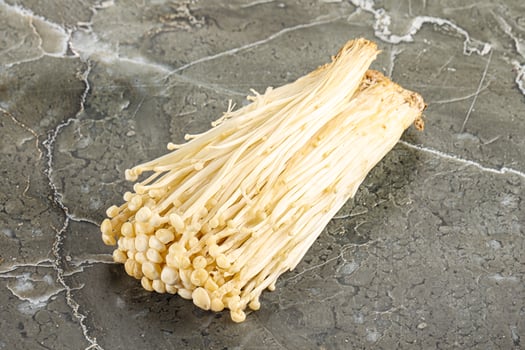 Tasty raw enoki mushroom heap photo