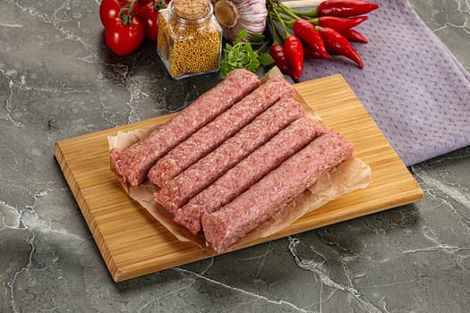 Raw beef kebab sausage for grill photo