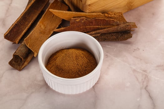 Natural Cinnamon powder with sticks photo