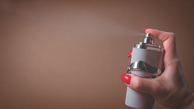 Age makeup. Perfume bottle with dispenser photo