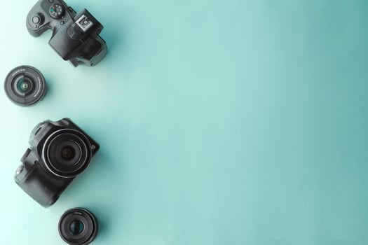 camera and lens over background photography concept. photo