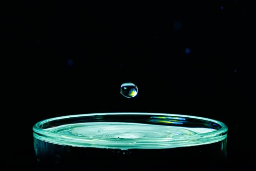 macro Beautiful drops in flight, colored drops photo