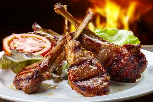 rack of lamb with lettuce and tomato photo