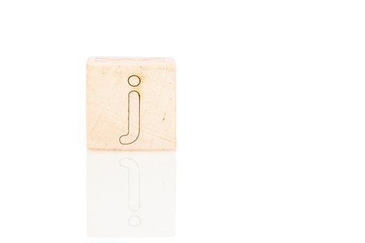 Wooden cubes with letters J on a white background photo