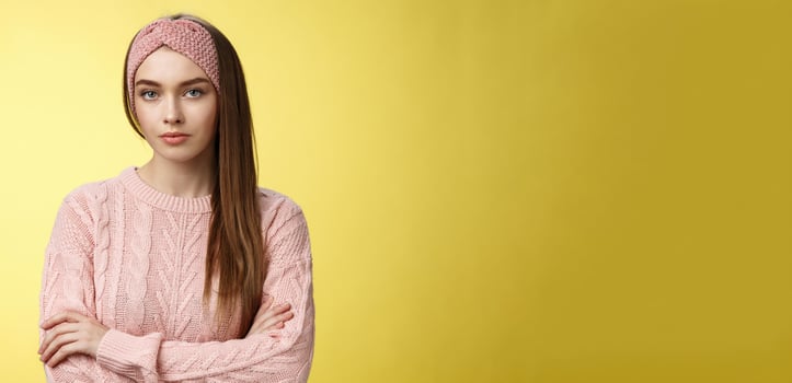 Serious-looking bossy focused intense young female office worker cross arms over chest in defensive confident pose, being displeased, dissatisfied and pissed with inappropriate employee behaviour photo