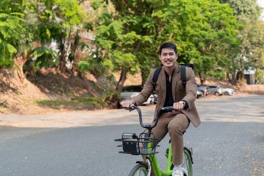 The businessman eco friendly transportation, cycling through the city avenues to go to work. sustainable lifestyle concept photo
