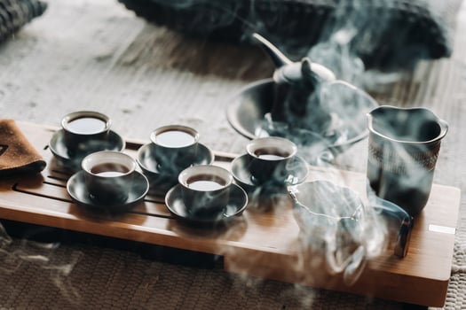 Tea ceremony with smoking incense. Incense stick and tea ceremony photo