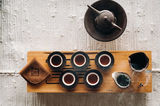 Preparing for a tea ceremony with a large company photo