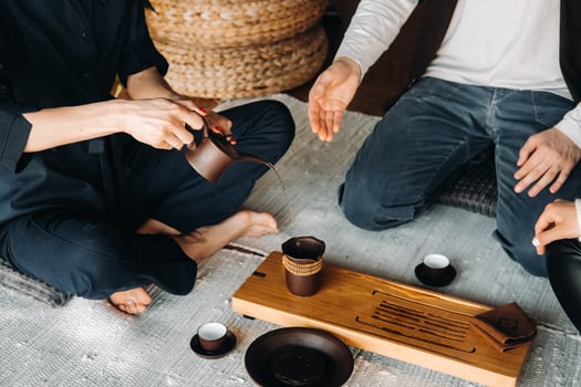 Preparing for a tea ceremony with a large company photo