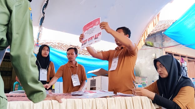 Demak, Indonesia - February, 2024 - Vote counting process at TPS, Indonesian presidential election. photo