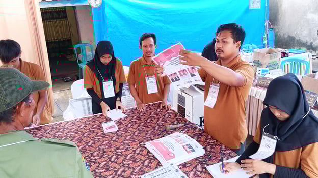 Demak, Indonesia - February, 2024 - Vote counting process at TPS, Indonesian presidential election. photo