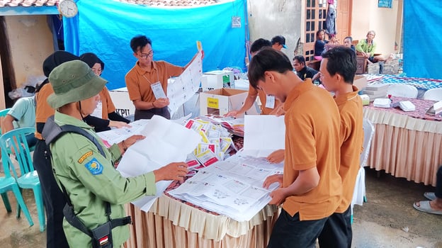 Demak, Indonesia - February, 2024 - Vote counting process at TPS, Indonesian presidential election. photo