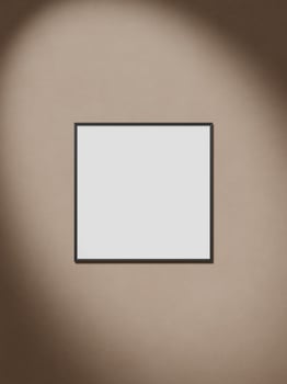 Frames hanging on brown wall with shadow photo