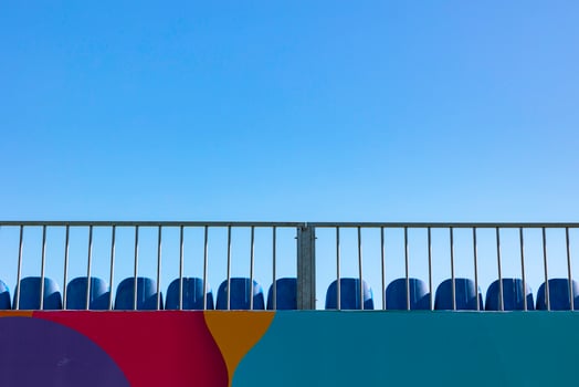 Empty or vacant seats on the top of the stadium with clear sky on background photo