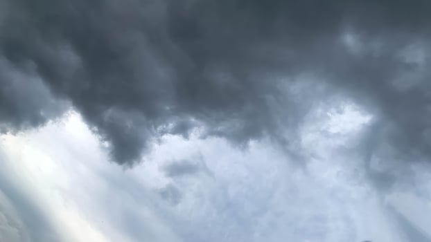 dark clouds and bright sunny weather photo