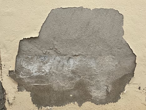 Old cement wall with peeling paint. Abstract background Old concrete wall with cracks and scratches. Great background or texture and texture for design photo